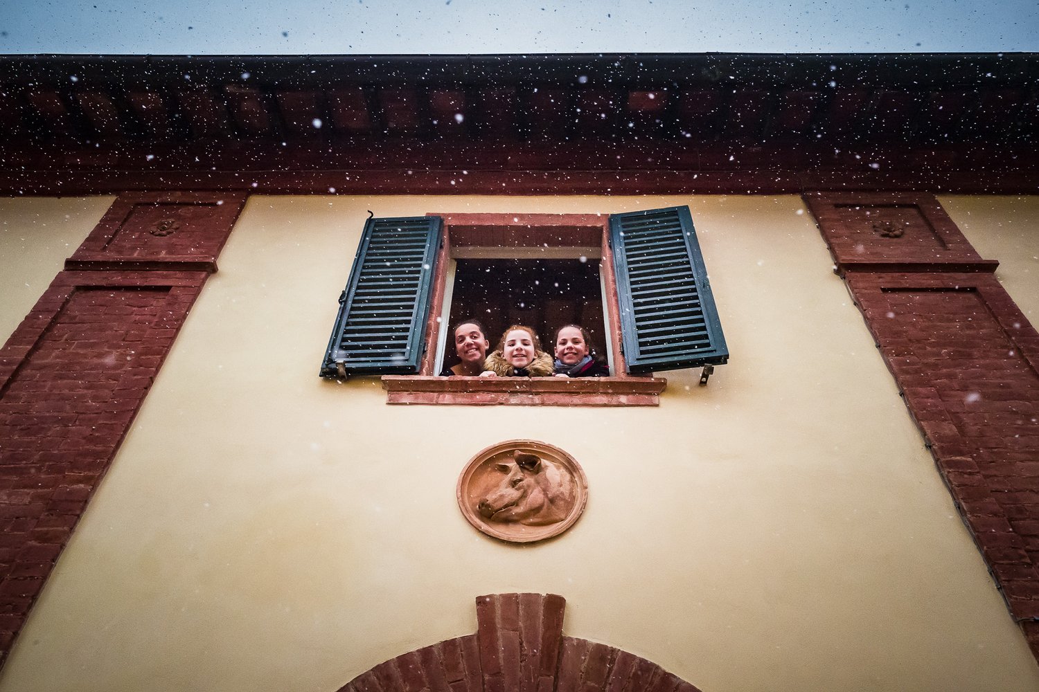  Snowing outside the house. 