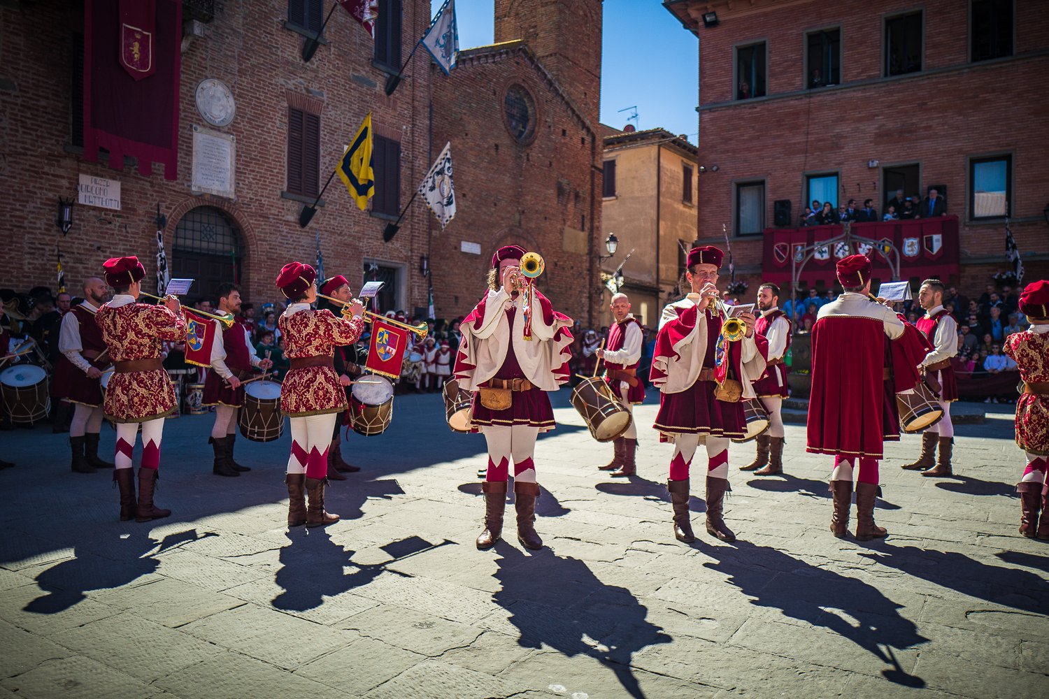  Then, representatives from each of the eight districts of the city paraded with their flags and uniforms. 