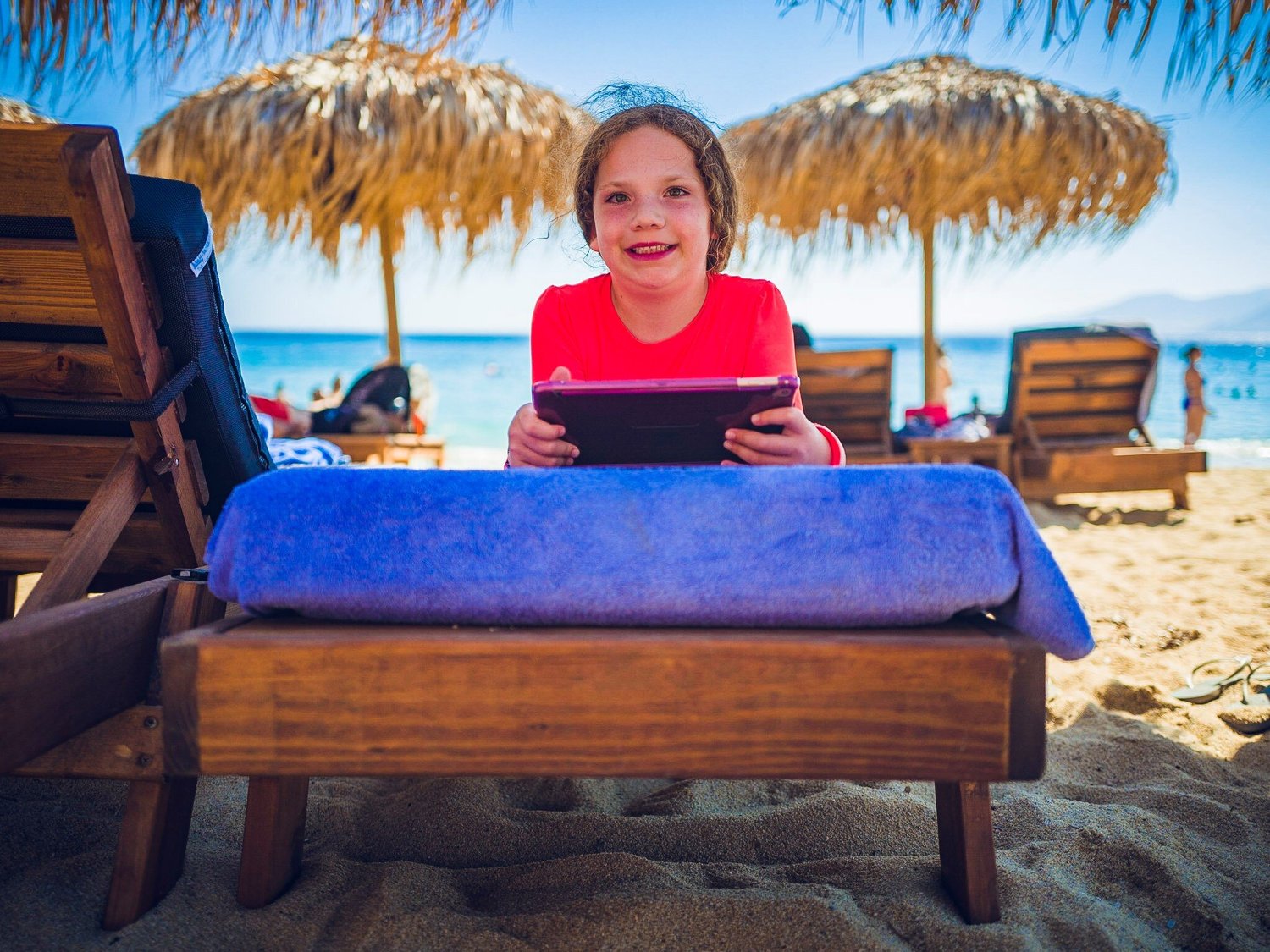 Audrey is pretty used to a deck chair, umbrella and drinks while at the beach now…